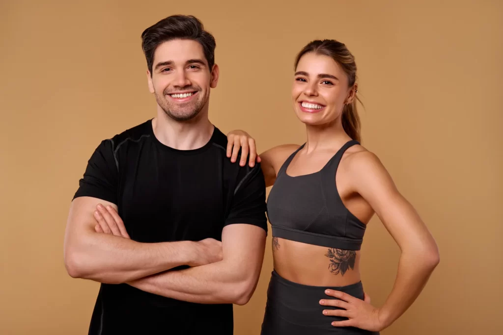 an energetic fitness duo is posing confidently aga utc