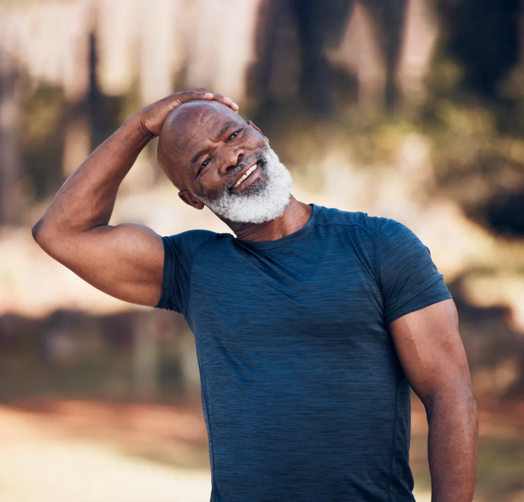 senior man stretching neck and exercise outdoor i utc